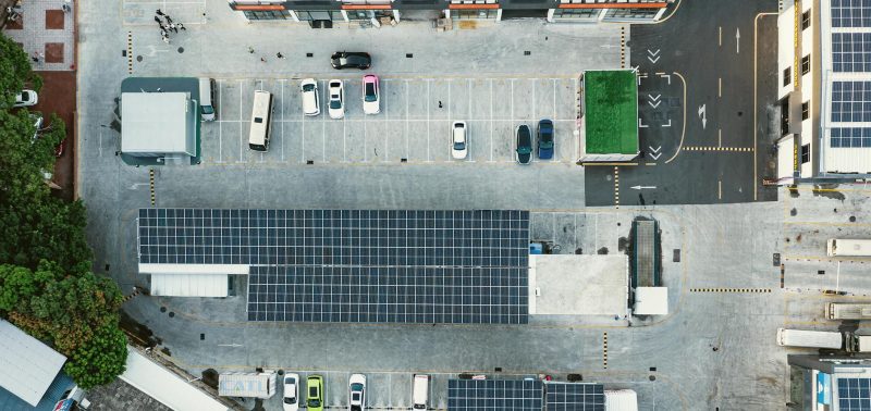 Electric vehicle charging station with solar panels